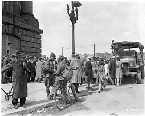 U.S. and Soviet soldiers and German citizens at a Berlin black market