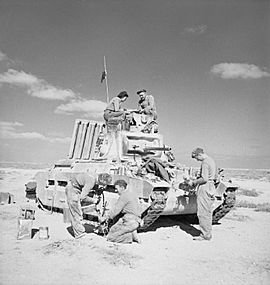 A Matilda tank crew overhauling their vehicle near Tobruk, 1 December 1941. E6864