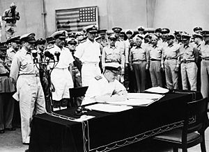 Admiral Sir Bruce Fraser signs the Japanese surrender document for Great Britain on board USS MISSOURI in Tokyo Bay, 2 September 1945. A30425
