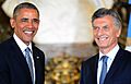Macri and Barack Obama, smiling and shaking hands