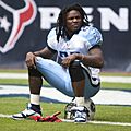 Chris Johnson sitting on his helmet