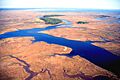 Grand Bay National Estuarine Research Reserve. East over Bayou Cumbest looking east showing maritime pine islands on Crooked Bayou