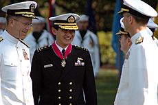 US Navy 070724-N-6512M-035 Chief of Naval Operations (CNO) Adm. Mike Mullen and Chief of Republic of Singapore Navy Rear Adm. Ronnie Tay enjoy a light moment while talking with OPNAV staff