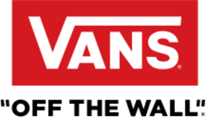 Storefront with large "VANS" sign and display windows showing shoes