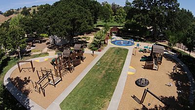 Aerial view of Hap Magee Ranch Park showing childrens playground in the foreground, picnic area on the left and park area in the background