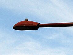 A flat-lens cobra luminaire, which is a full-cutoff fixture, is very effective in reducing light pollution. It ensures that light is directed only below the horizontal, which means less light is wasted by directing it outwards and upwards.