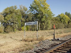 Sign for Hannah Junction along the railroad
