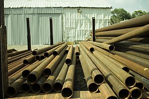 Metal tubes stored in a yard