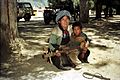 Mother & son playing lute. Lhasa 1993