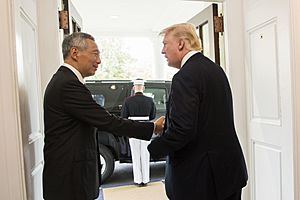President Donald Trump bids farewell to Singapore Prime Minister Lee Hsien Loong