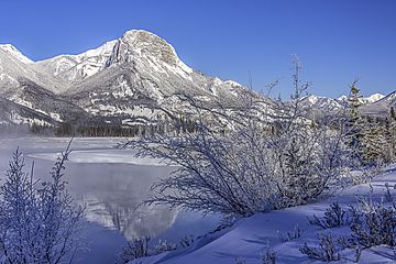 Roche Ronde reflected in the Athabasca River.jpg