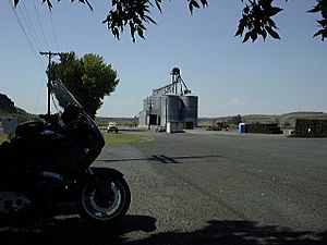 The street in Irby features this grain elevator (1998)