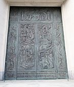 Church front door with bas-relief sculpture