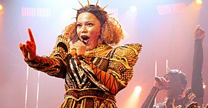 Jarneia Richard-Noel as Catherine of Aragon in the West End production of Six at the Arts Theatre, 2019.jpg