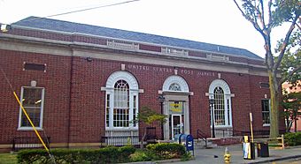 Front view of Peekskill post office showing main entrance and three Palladian windows