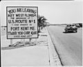 Photograph of a road sign along the highway in Key West, Florida, announcing the beginning of U.S. Route 1 to Fort... - NARA - 200542