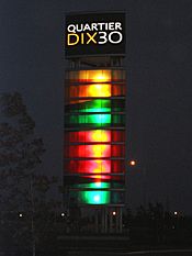 Quartier DIX30 tower night.jpg