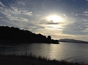 The sun shines through the clouds at China Camp