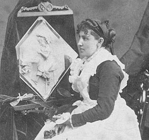 1877 Caroline S. Brooks and her sculpture in butter during a public exhibition at Amory Hall in 1877, from Robert N. Dennis collection of stereoscopic views