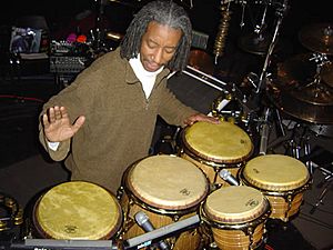 Bashiri Johnson playing percussion.