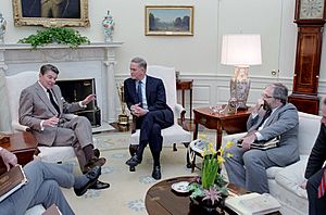 President Ronald Reagan meeting with Senator Bob Packwood to discuss Tax Reform with Bill Diefenderfer, Don Regan and William Ball in the Oval Office