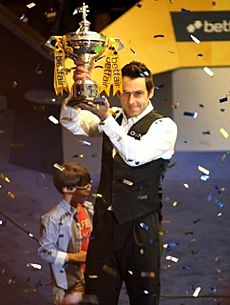 Ronnie O'Sullivan with World Championship Trophy 2013