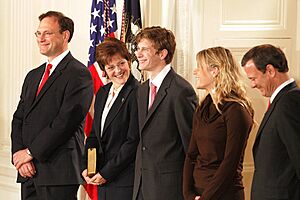 Samuel Alito and his family with John Roberts