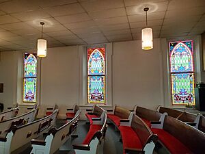 Sanctuary of Chesterville Community Church with stained glass windows circa 1890's