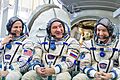 Soyuz MS-11 backup crew in front of the Soyuz spacecraft mockup