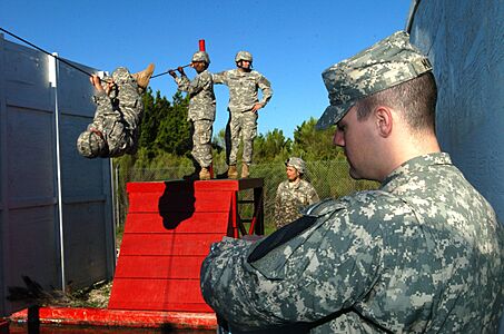 US Army 52449 1st Lt. Mike Munroe, a grader with 5th Battalion 82nd Field Artillery Regiment, 4th Brigade Combat Team, 1st Cavalry Division, monitored the time as Spc. Vincent Stringer, a Cannon Crewmember, assigne