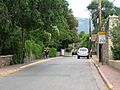 View of El Zaguan on Canyon Rd. Bldg on left with white fence.