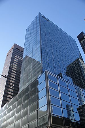 The glass facade of 660 Fifth Avenue as seen from ground level