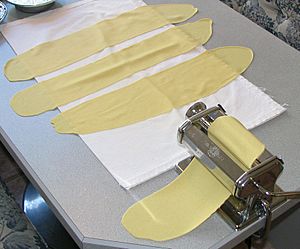 Alkaline pasta being rolled out with an Italian pasta machine, Sept 2010.jpg