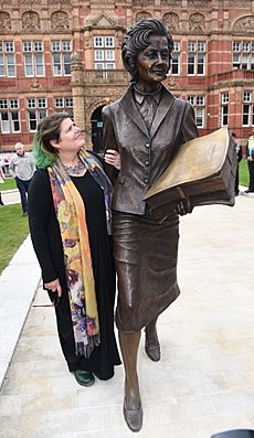 Artist Sam Holland and her Barbara Castle bronze statue in Blackburn