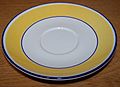 Saucer with yellow and white design