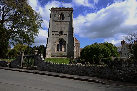 TWO ROMAN COLUMNS FLANK THE GATE TO THE CHURCHYARD