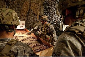 Army Sgt. Chris Rohling, center, with Provincial Reconstruction Team Kapisa, gives a mission brief to his squad before training to respond to improvised explosive device attacks, at the Camp Atterbury Joint 111216-A-PX072-120