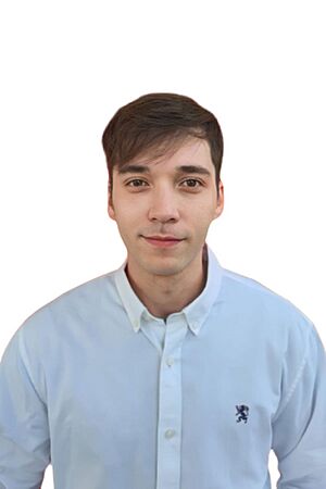 Stefan William wearing a white shirt, looking directly at camera with slight smile