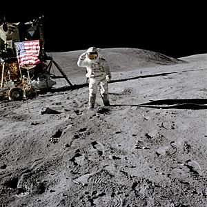 Lunar Module Pilot Charles Duke salutes the flag