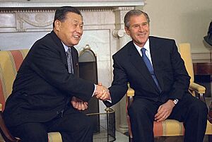President George W. Bush and Prime Minister Yoshiro Mori shake hands during a meeting in the Oval Office - 2001