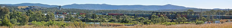 Panorama of Sugarloaf Range and freight train.
