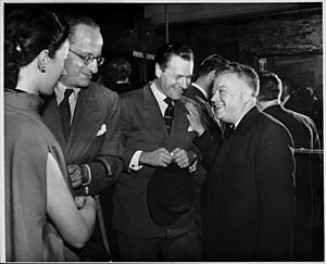 David Dubinsky and Nelson Rockefeller socialize with others.