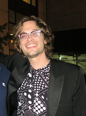 Head shot of Matthew Gray Gubler wearing glasses and smiling