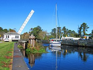 Highway bridge open for passage of sailboat at South Mills on the Intracoastal Waterway (Dismal Swamp Canal)