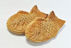 Two fish-shaped, somewhat flat pastries.
