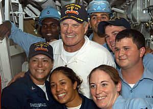 US Navy 040902-N-3019M-011 National Football League (NFL) Hall of Fame quarterback Terry Bradshaw poses with Sailors during a visit aboard the guided missile cruiser USS Port Royal (CG 73)