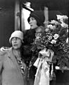 Dolores Del Rio with her mother on the steps of a train, holding a bouquet of roses (4951163325)