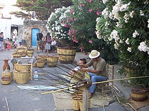 Making wickerware in main square of Cabanes