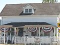 House with American flag bunting at 4299 Nicasio Valley Road
