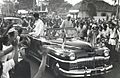 Jawaharlal Nehru's motorcade passing through the crowded streets of Djakarta, Indonesia,1950